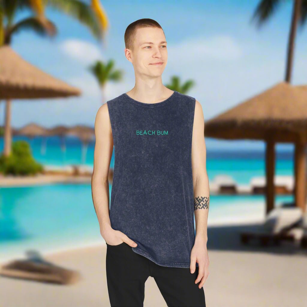 Dude wearing a sleeveless Beach Bum tee. hanging out in swank beach resort.