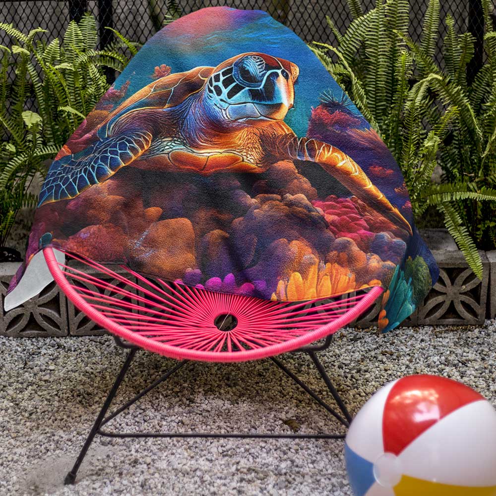 Sea Turtle beach towel draped over pool chair