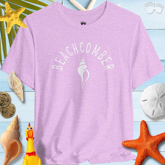 Beachcomber shelling t-shirt in lavender surrounded by seashells and beach decor.