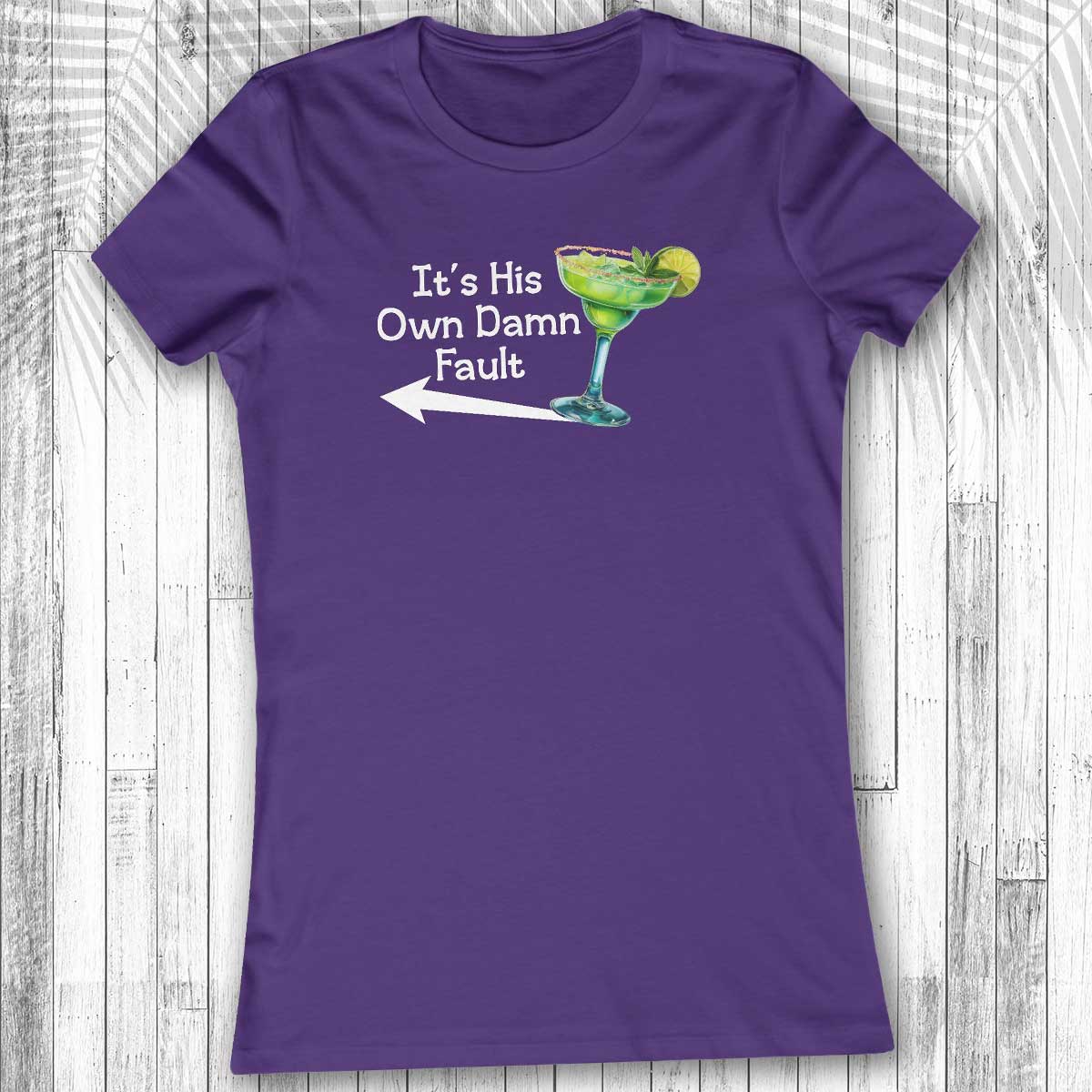 Purple Women's Margarita Tee with a graphic and text on a wooden surface