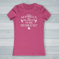 Pink t-shirt with a white emblem design on a nautical wood  background