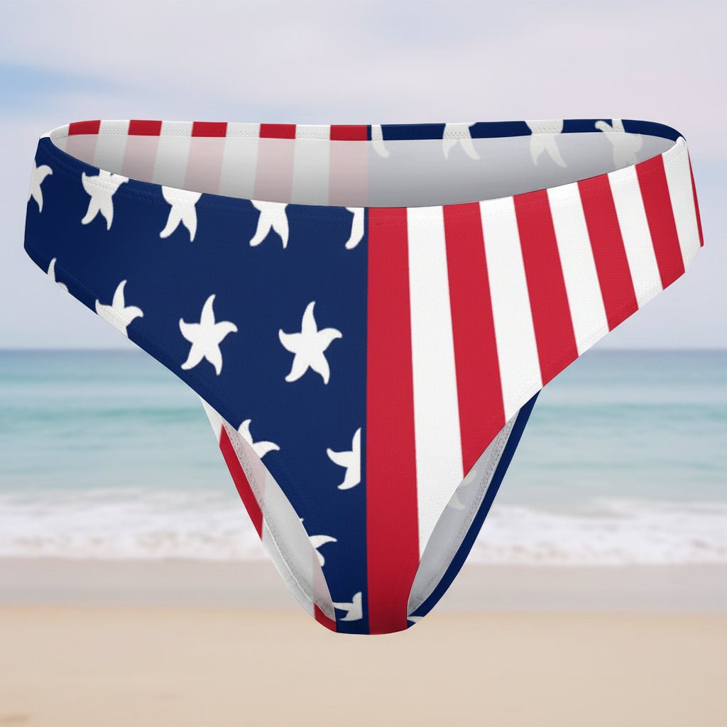 Bikini bottom with American flag pattern on a faded beach background