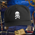 Skull & Bones Surf Cap | Jolly Pirate with a white skull design, perfect for beach adventures and outdoor sports.