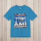 Blue t-shirt with 'Rod Reel Pier' and 'AMI Strong' graphic on a rustic nautical wood background
