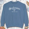 Blue sweatshirt Shelling Clothes with 'Old Junonia' text on a wooden surface with seashells.