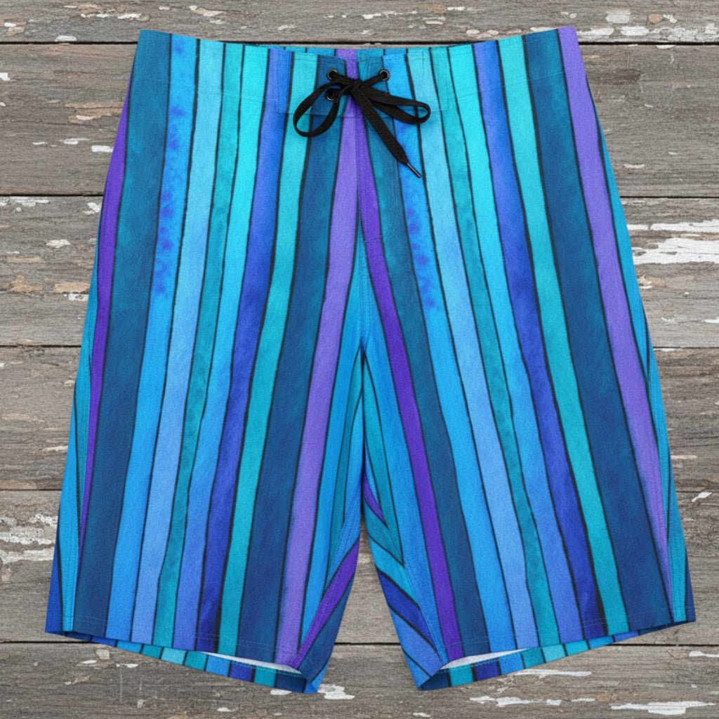 Blue striped board shorts laying flat on a rustic wood background
