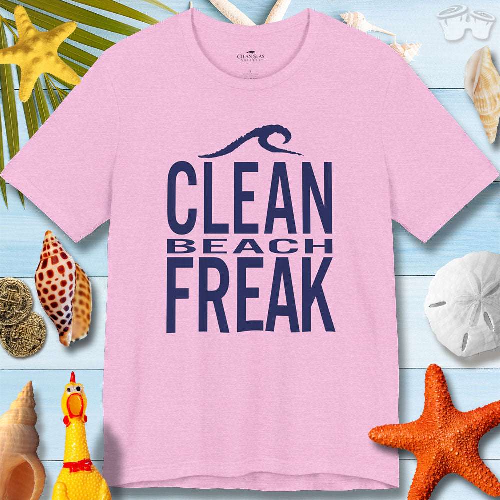 Clean Beach Freek unisex jersey tee in pink, perfect for summer beach vibes, surrounded by seashells and beach decor.