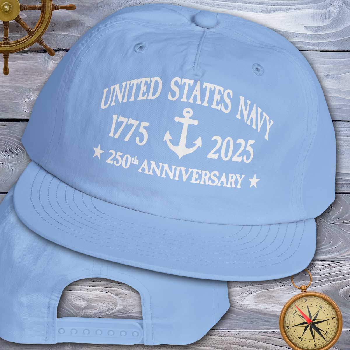 Blue cap with 'United States Navy 1775-2025 250th Anniversary' text on a wooden background