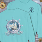 Light blue t-shirt with United States Navy 250th Anniversary design on a wooden surface.
