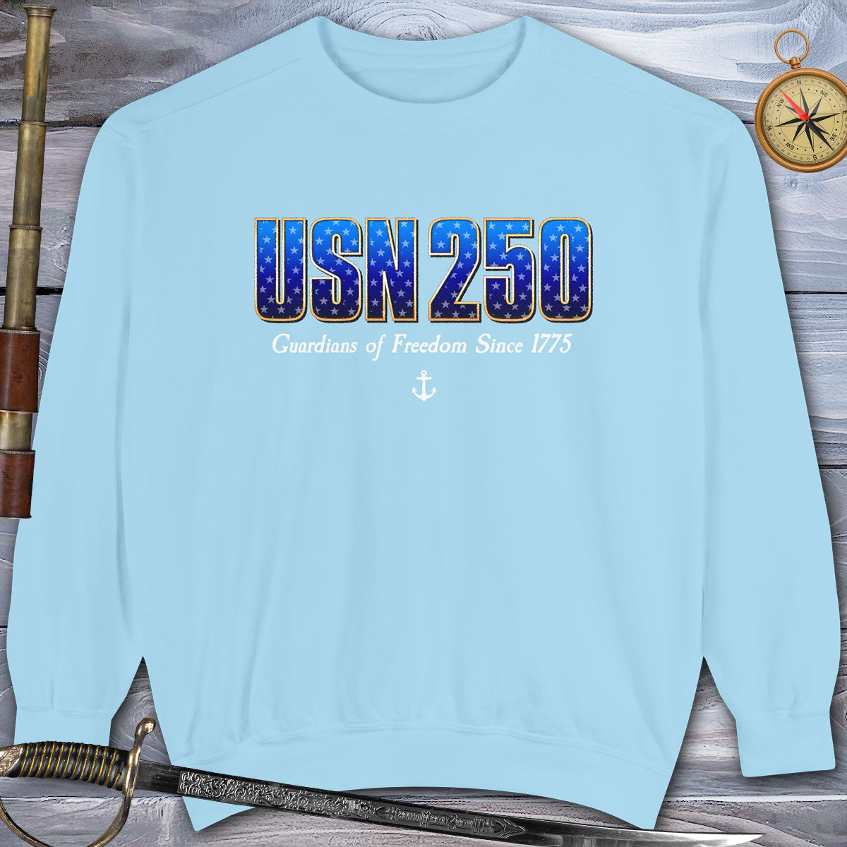 Light blue sweatshirt with 'USN 250' text on a wooden background