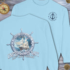 Light blue t-shirt with United States Navy 250th Anniversary design on a wooden surface.