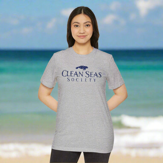 girl wearing a gray 'Clean Seas Society' t-shirt on a white background