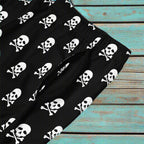 Closeup view of pirate skull board short pocket.