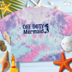Tie-dye crop tee featuring 'Off Duty Mermaid' art, perfect for a laid-back beachy style.