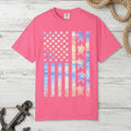 Pink t-shirt with a colorful American flag design featuring turtles on a nautical background