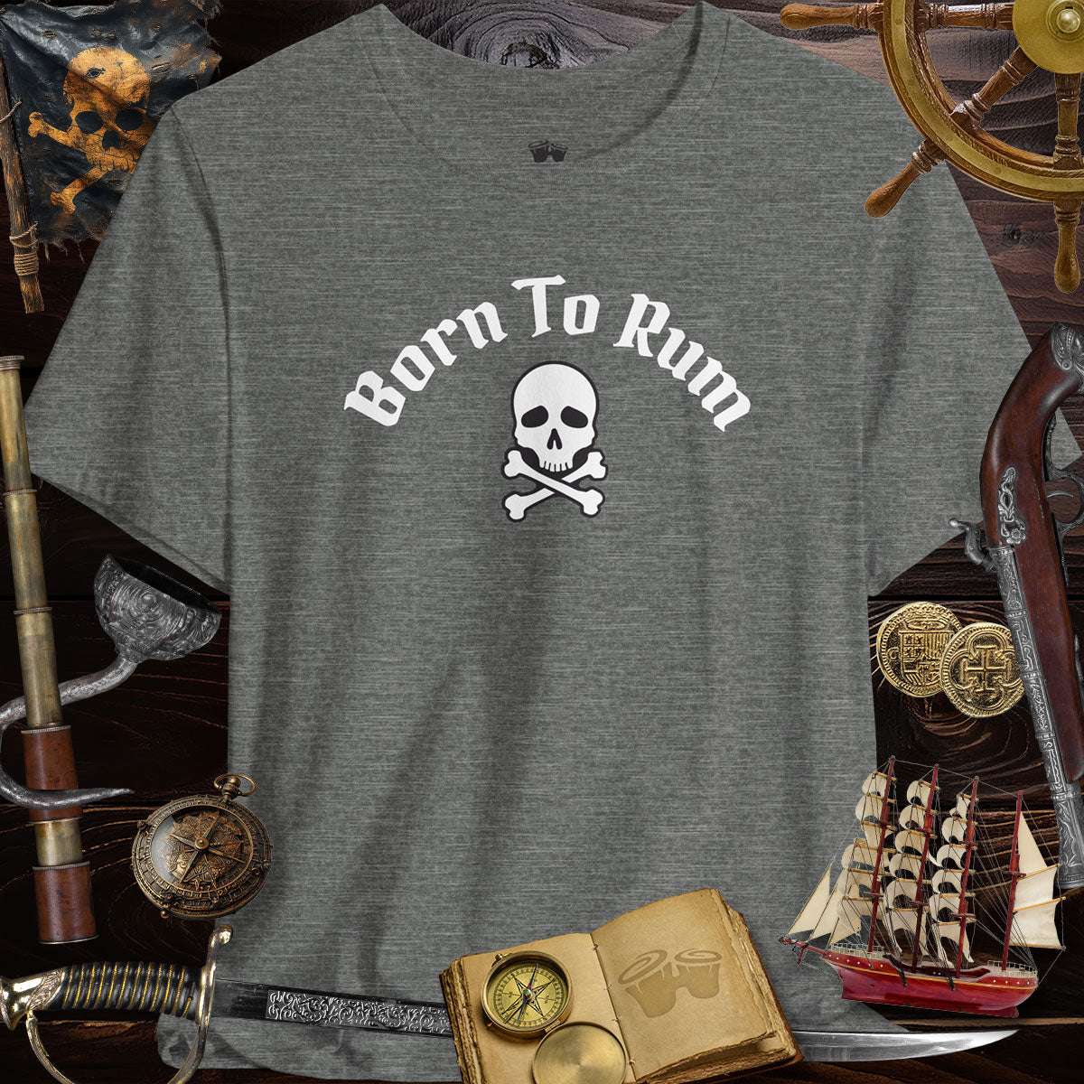 Born to Rum Jolly Roger Pirate Skull on casual Bella Canvas T-Shirt surrounded by pirate-themed decor.