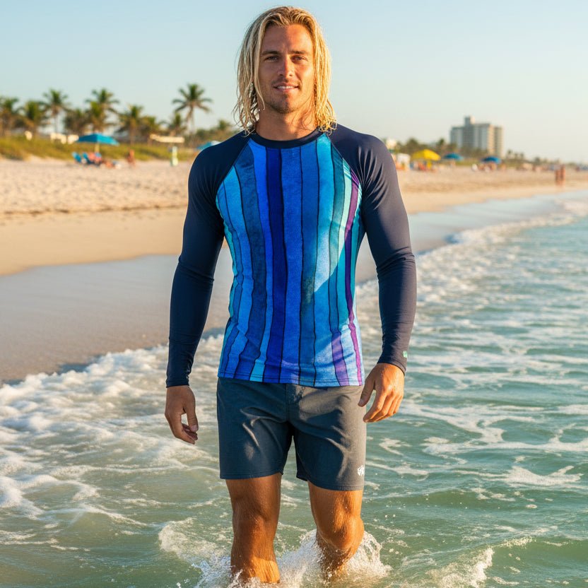 Man wearing a blue and purple striped long-sleeve rash guard on Delray Beach