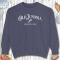 Navy blue sweatshirt with 'Old Junonia Sheller's Club' text on a wooden surface.