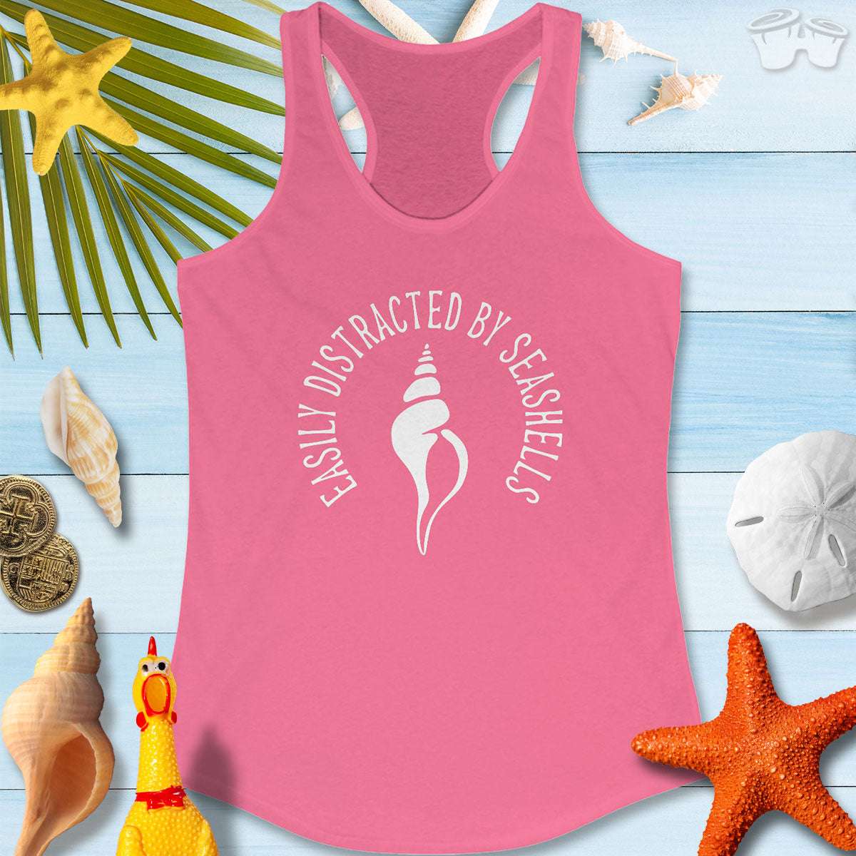 Beachy Women's Racerback Tank in pink with seashell design, perfect for beach lovers and summer fun.