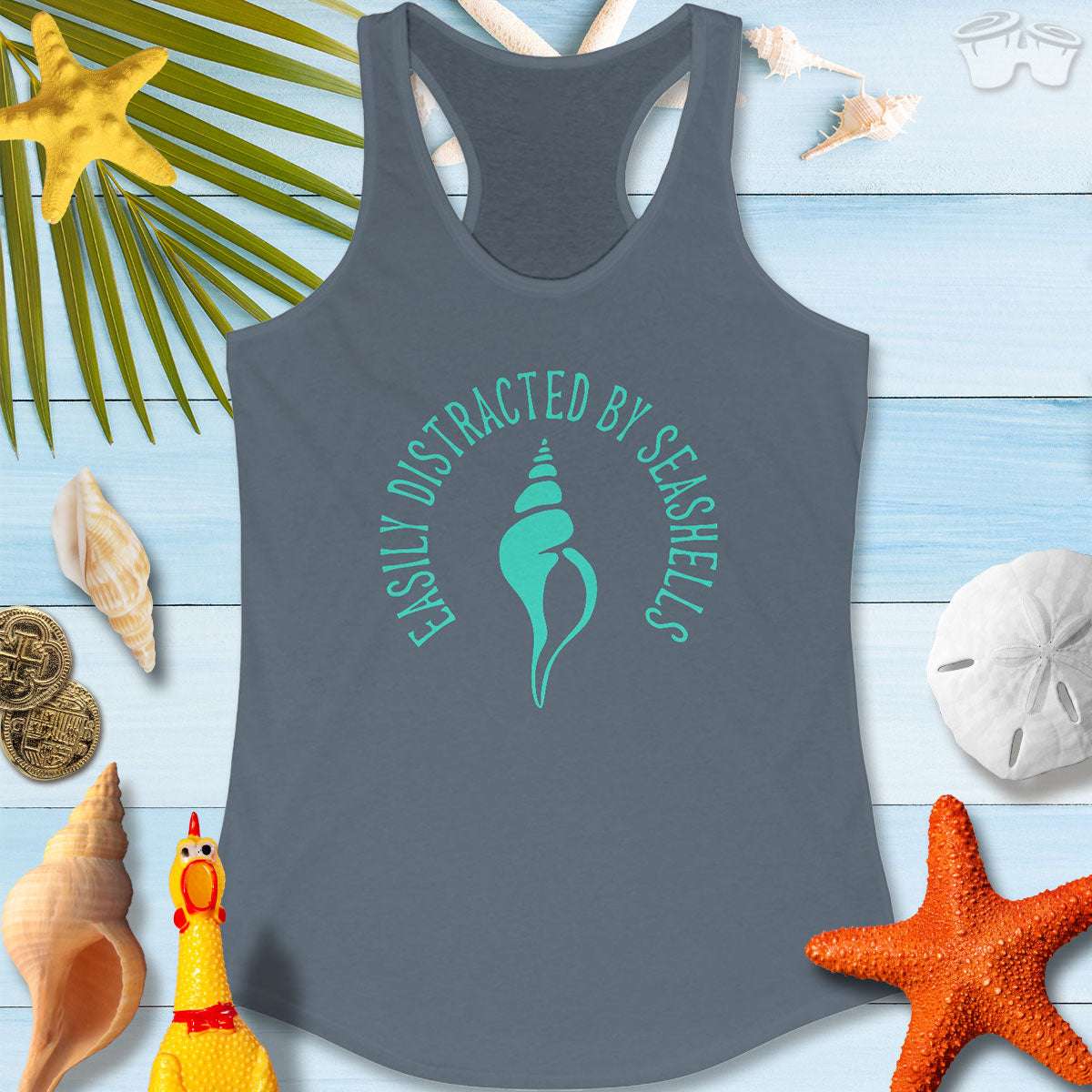 Beachy Women's Racerback Tank with seashell graphic, saying 'Easily Distracted By Seashells', perfect for beach lovers.