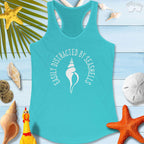 Lightweight beachy women's racerback tank top saying 'Easily Distracted by Seashells' with seashell design.