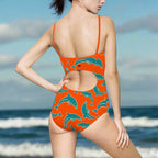Model wearing Orange Dolpnin One Piece Bathing Suit Facing The Ocean