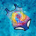 Colorful tie-dye swimsuit with a dolphin design on a pool floor background