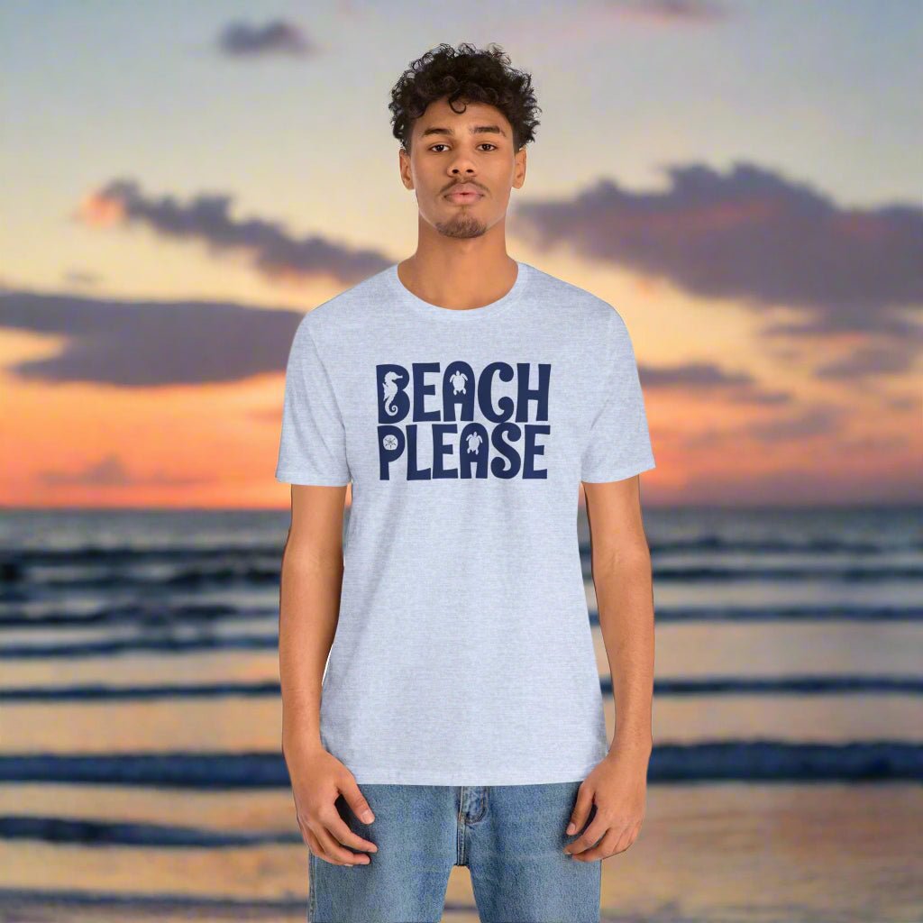 Person wearing a 'Beach Please' t-shirt with a beach sunset background