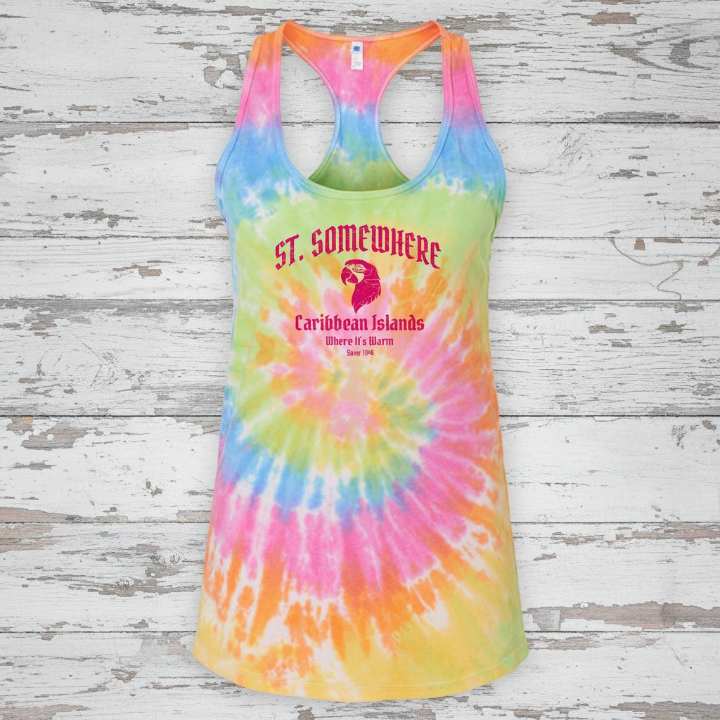 A racerback tank top with a vibrant rainbow tie-dye spiral pattern, featuring a graphic print on the front that reads 'ST. SOMEWHERE' and 'Caribbean Islands' in pink text with a parrot illustration.