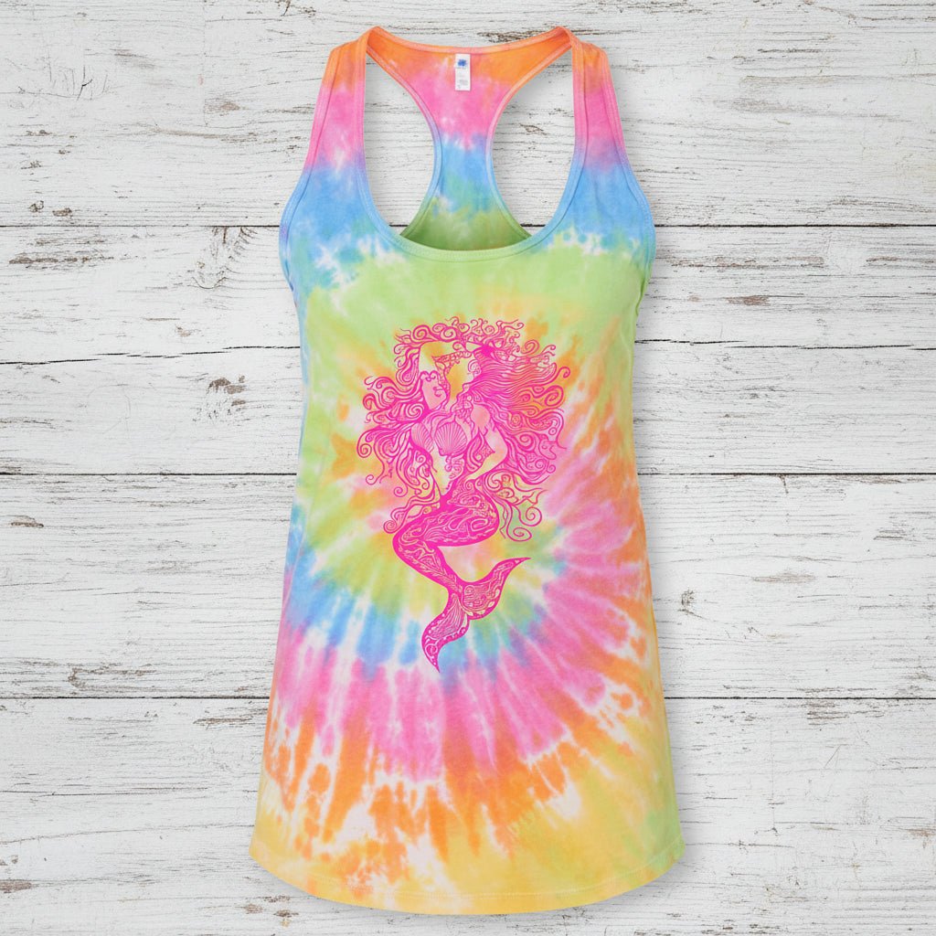 A sleeveless racerback tank top with a vibrant rainbow tie-dye spiral pattern and a large pink mermaid graphic printed on the front, shown against a plain white background.