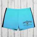 Blue athletic shorts with 'Fintastic Athletics' branding on rustic nautical background