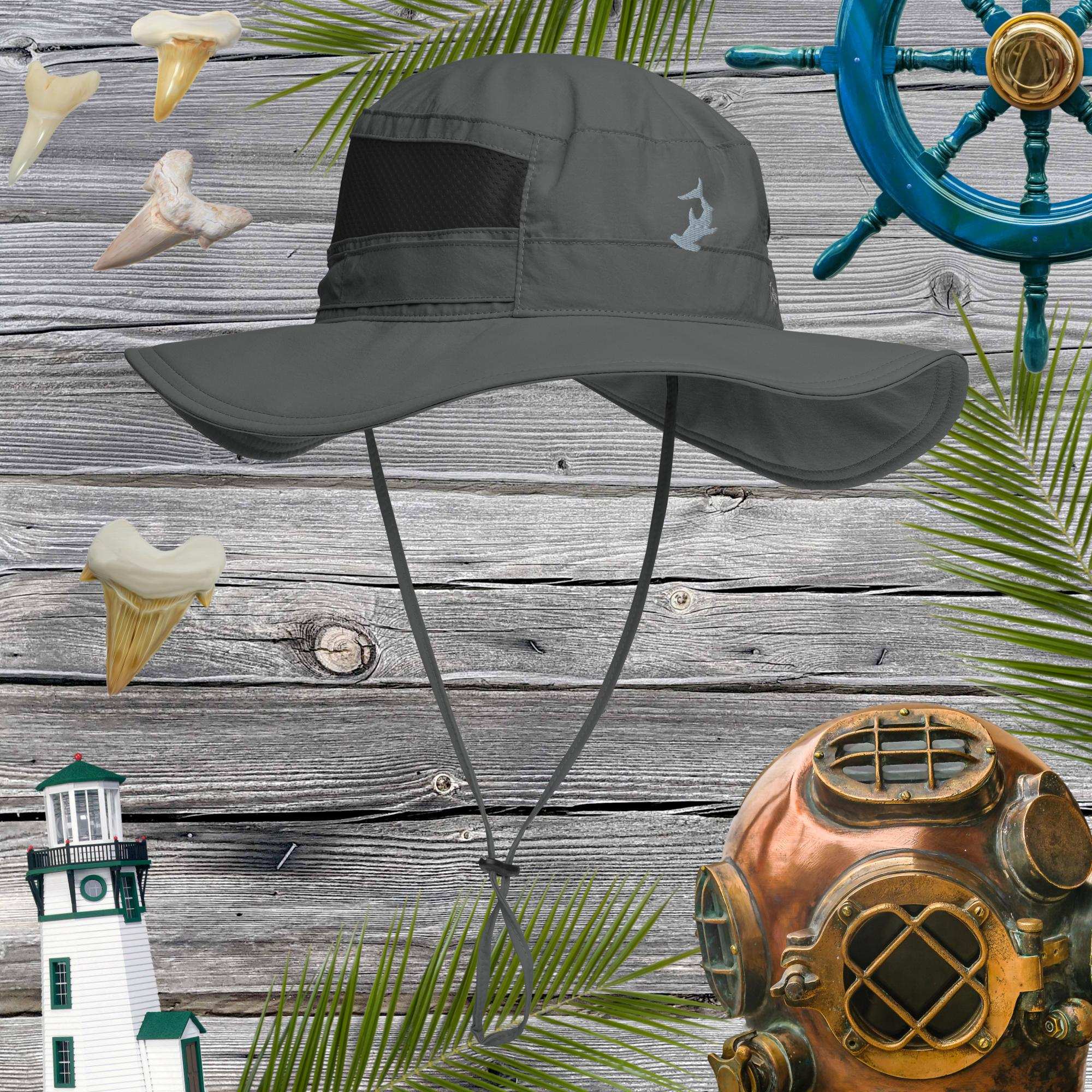 Gray sun hat with chin strap on a wooden background with nautical decorations.
