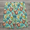 Colorful swim shorts with parrot and drum pattern on a rustic wood background