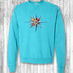 Turquoise sweatshirt with a colorful nautical compass design on a wooden background