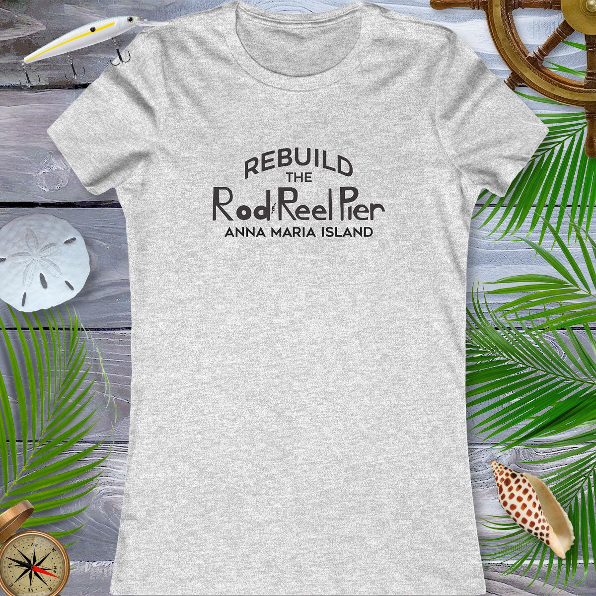 Gray t-shirt with 'Rebuild the Rod & Reel Pier Anna Maria Island' text on a wooden background with beach elements.