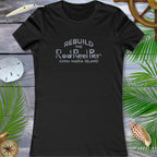 Black t-shirt with white text on a wooden surface with decorative elements