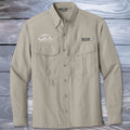 Beige Fishing Shirt with brand logos on a wooden surface