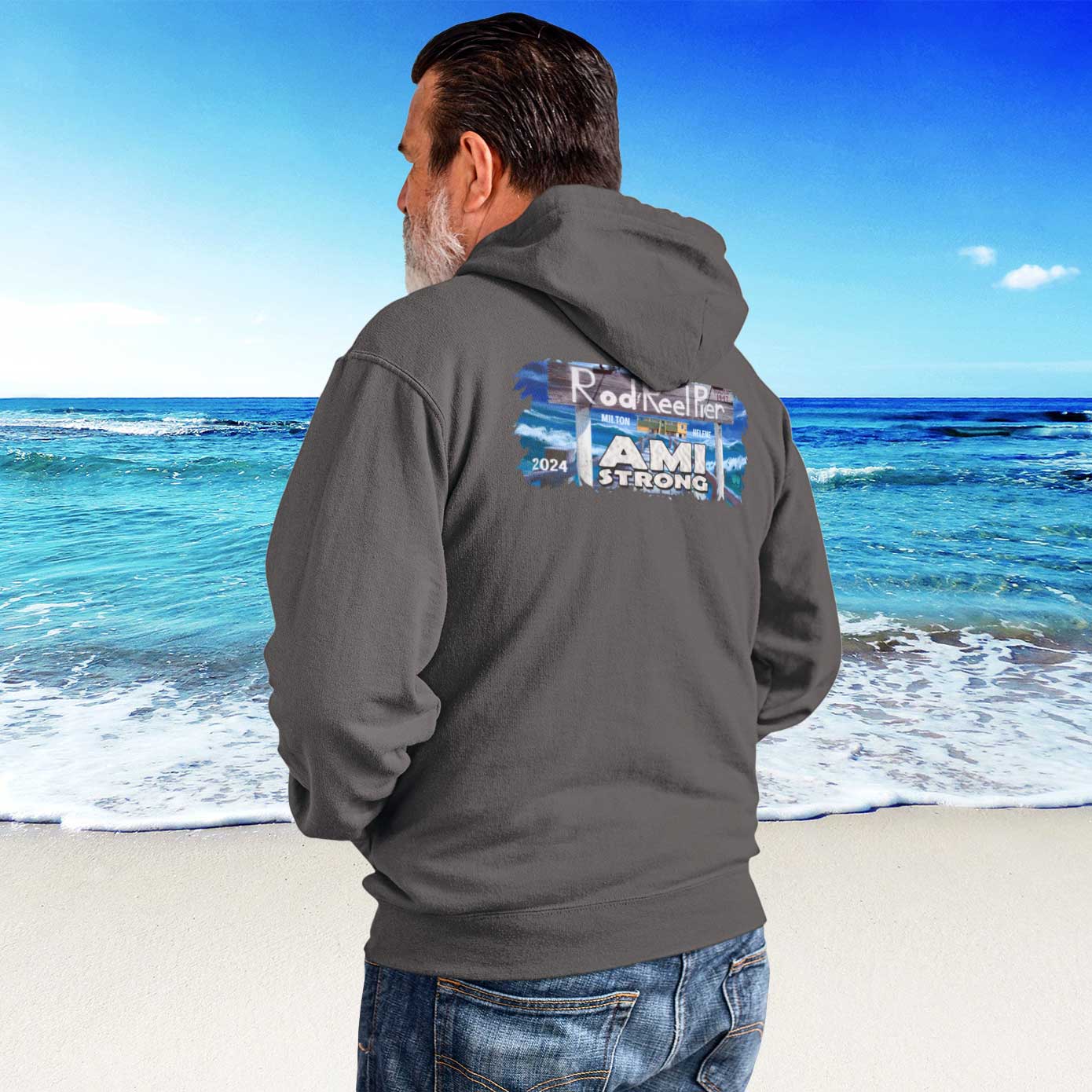 Man wearing a gray hoodie with text on Anna Maria Island beach