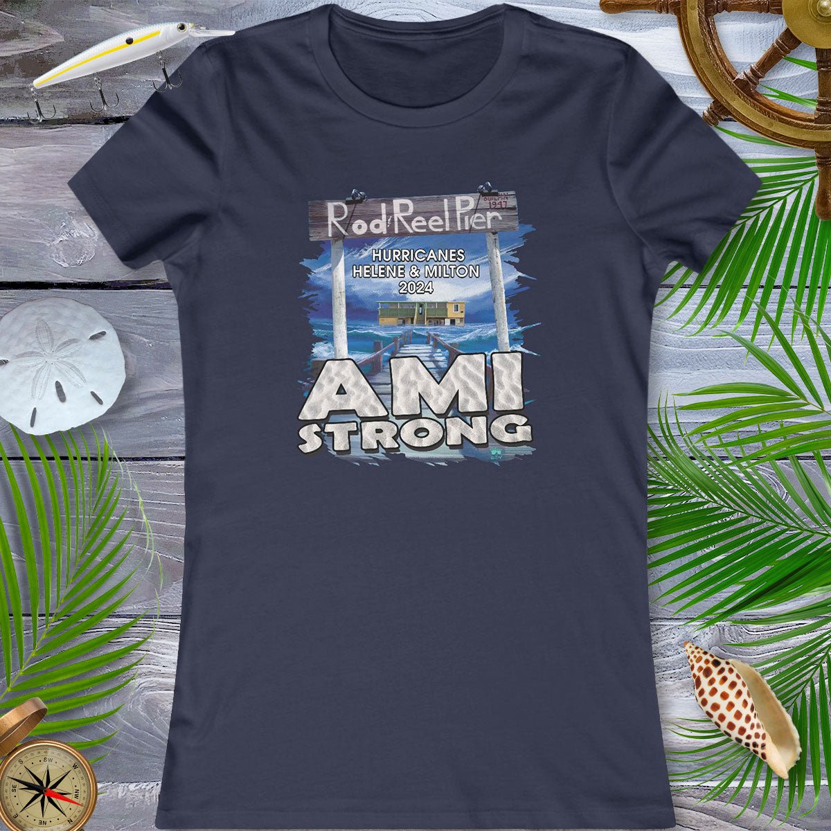 Navy blue t-shirt with 'AMI Strong' graphic on a wooden surface with decorative elements.