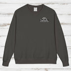 Dark gray sweatshirt with a logo on a wooden surface