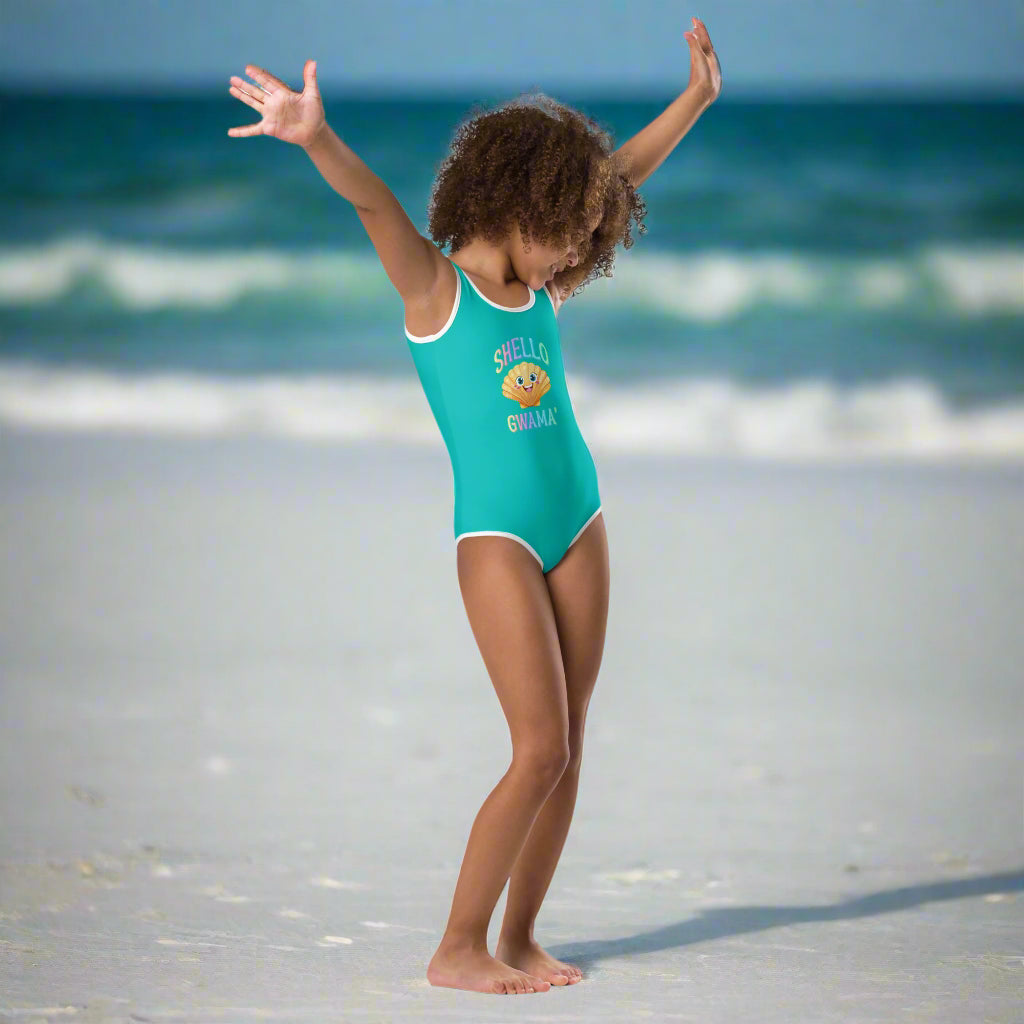 Girl in Turquoise One Piece Swimsuit saying SHello Gwama design dancing on Pensacola Beach
