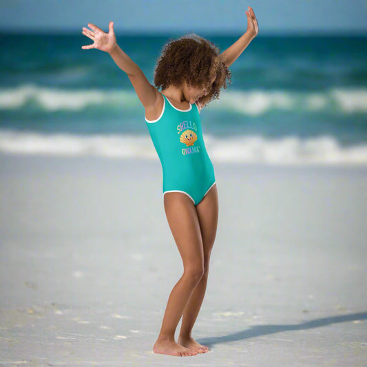 Girl in Turquoise One Piece Swimsuit saying SHello Gwama design dancing on Pensacola Beach