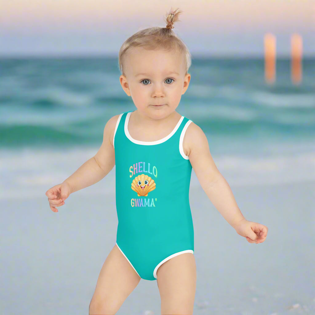 Girl's One Piece Toddlers' Swimsuit saying SHello Turquoise worn by a toddler on Pensacola Beach