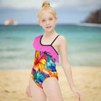 Girl wearing a colorful Hawaiian style swimsuit with floral design on Waikiki beach 