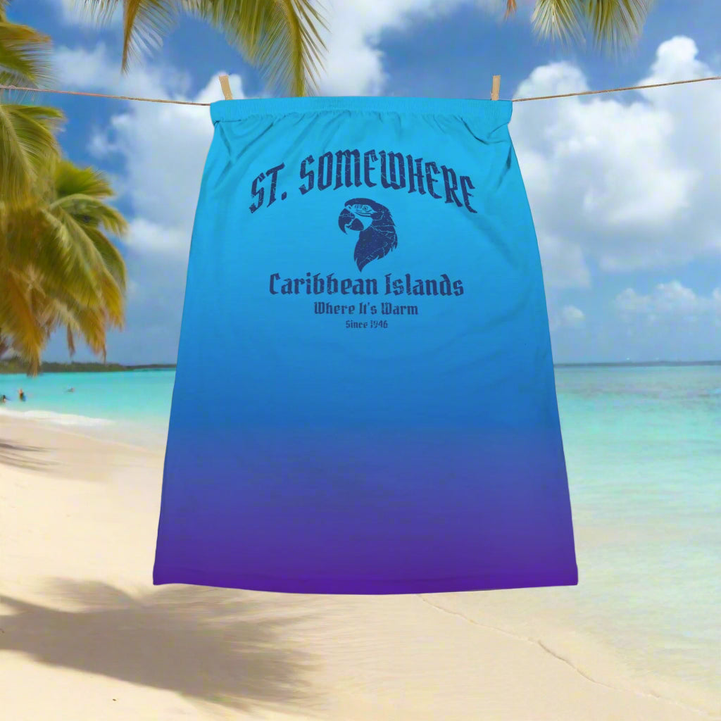 Blue and purple gradient Tube Top Crop with St. Somewhere Island Graphic hanging on a line in some Caribbean Paradise