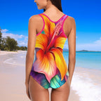 Woman wearing a colorful floral swimsuit on a beach