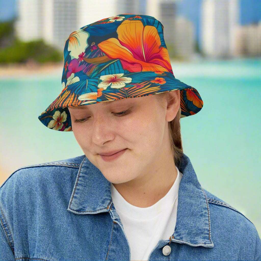 Girl wearing a Hawaiian print bucket hat from Bongo Beachwear is hanging out at Waikiki Beach