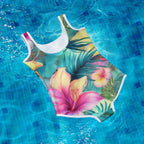 Colorful swimsuit with floral design floating in a pool