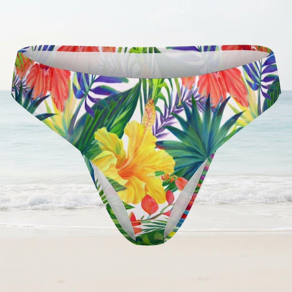Colorful tropical floral patterned underwear on a faded beach background