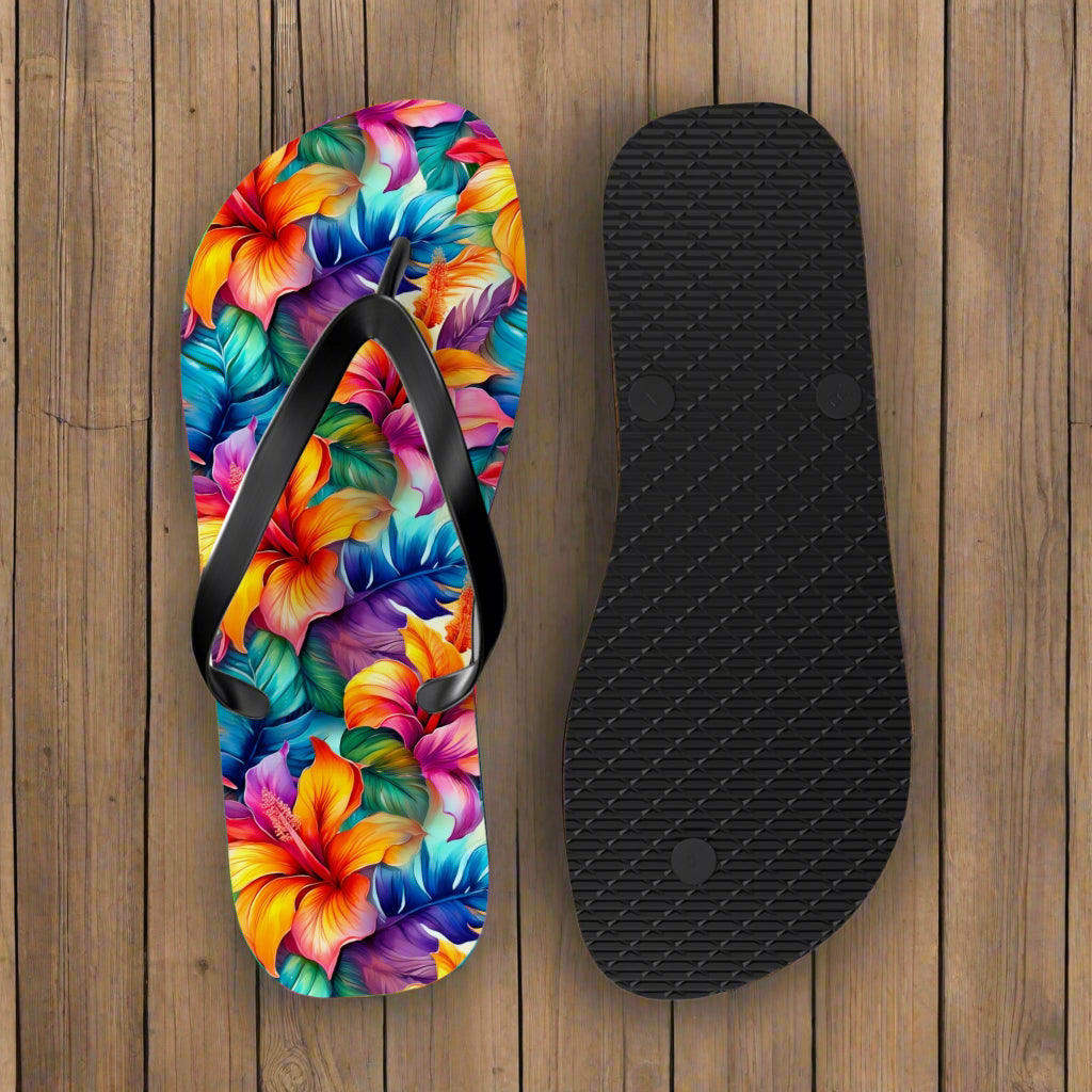 Colorful floral flip-flop sandal with a black insole on a nautical wood background